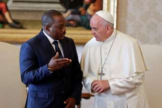 Pope Francis talks with Congolese President Joseph Kabila during a private audience at the Vatican Sept. 26.