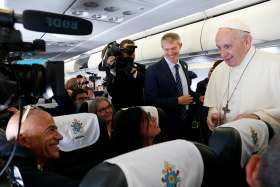 Pope Francis greets Associated Press cameraman Paolo Lucariello