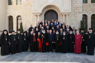  Members of the executive committee of the Middle East Council of Churches pose for a group photo during their Jan. 22-23 meeting in Atchaneh, Lebanon. 