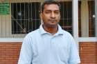 Father Walter William Rozario is pictured March 12 outside Good Shepherd Cathedral in Rajshahi, Bangladesh. 