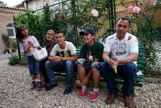 Syrian refugees Ramy and Suhila and their children, Khodus, Rashid and Abdul Mejid, relax in Rome in 2016 after Pope Francis brought them with him from a refugee camp in Lesbos, Greece.