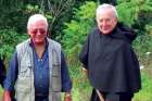 Ted Harasti, left, and Br. Paul Koscielniak break ground on the rosary path.