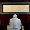 Pope Benedict XVI prays in front of the Shroud of Turin in the Cathedral of St. John the Baptist in Turin, Italy, May 2 2010. According to tradition, the 14-foot by 4-foot Shroud of Turin is the linen burial shroud of Jesus.