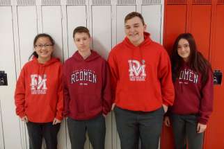 Some students from Denis Morris Catholic High School are allowed to continue wearing Redmen sweats, shirts and jerseys for the next four years during a transition period as the school changes its team name to Reds.