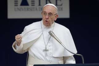 Pope Francis gestures as he talks during a Feb. 17 meeting at Roma Tre University.
