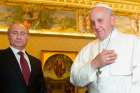 Pope Francis smiles alongside Russian President Vladimir Putin during a private audience at the Vatican Nov. 25, 2013.