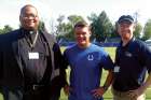 Fr. Douglas Hunter, Catholic chaplain for the Indianapolis Colts, poses with Colts’ general manager Chris Ballard and Dave Neeson of Catholic Athletes for Christ.