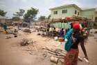 A woman carries a child through a camp in the state of Benue, Nigeria, April 11, 2018.