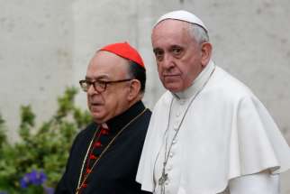 Pope Francis and Cardinal Raymundo Damasceno Assis of Aparecida, Brazil, walk to a meeting of cardinals in the synod hall at the Vatican Feb. 20, 2014. In a statement released by the Vatican Sept. 28, 2019, the pope named Cardinal Damasceno as pontifical commissioner of the Heralds of the Gospel and its religious branches for consecrated men and women.