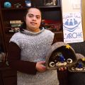 Ayat Sand, 21, a Palestinian with an intellectual disability, holds a Nativity set made from felted wool from Bethlehem sheep at the Ma’an lil-Hayat in Bethlehem, West Bank.