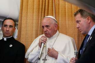 Pope Francis answers questions from journalists aboard his flight from Baku, Azerbaijan, to Rome Oct. 2. The Pope said that gay and transgender people deserve the same attentive pastoral care as anyone else.