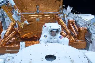 Astronaut Mike Massmino services the Hubble Space Telescope in the cargo bay of the space shuttle Atlantis May 15, 2009.