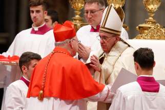 Pope Francis greets new Cardinal Kevin J. Farrell, prefect of the new Vatican office for laity, family and life, during a consistory in St. Peter&#039;s Basilica at the Vatican Nov. 19. The pope created 17 new cardinals