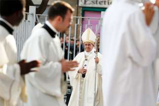  Pope Francis walks in procession as he arrives to celebrate Mass at Blessed Sacrament Parish in Rome May 6.