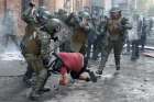 Police in Santiago, Chile, clash with a demonstrator Nov. 14, 2019, during a protest against Chile&#039;s government. Chile&#039;s bishops Nov. 9 called for national dialogue and an end to the violence that has wracked the country for a month.