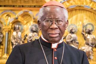  Nigerian Cardinal Francis Arinze poses May 23 in Buckfast Abbey in Buckfastleigh, England. Communion is exclusively for Catholics in a state of grace and not something to be shared between friends like beer or cake, said Cardinal Arinze. 