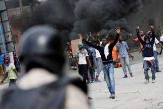Protesters in Port-au-Prince, Haiti, clash with security forces Oct. 4, 2019, during a demonstration to demand the resignation of President Jovenel Moise. As Port-au-Prince began its fourth week of paralysis due to serious social unrest, the Haitian bishops&#039; justice and peace commission called on Moise to step down.