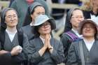 Nuns listen intently as Pope Francis leads the Angelus from the window of his studio overlooking St. Peter&#039;s Square Oct. 22 at the Vatican.