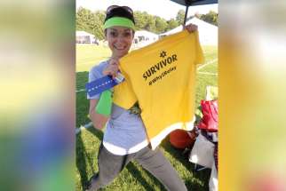 Jill Forester poses with her Survivor t-shirt at last year’s Relay for Life fundraising event.