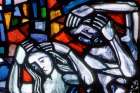 Adam and Eve are depicted in a stained-glass window at St. Nicolas Church in Feldkirch, Austria.