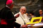 Pope Francis smiles as Archbishop Angelo De Donatis, papal vicar for the Diocese of Rome, speaks during a meeting with diocesan leaders at St. John Lateran Basilica May 14.