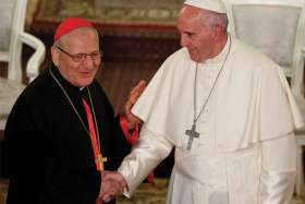 Pope Francis greets Cardinal Louis Sako, the Baghdad-based patriarch of the Chaldean Catholic Church, in Tbilisi, Georgia, in this Sept. 30, 2016, file photo. Sako said the Church in Iraq is working with the government to prepare for Pope Francis’ planned March 5-8 visit to Iraq.