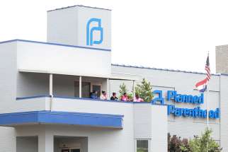 Planned Parenthood employees stand outside the facility during protests in St. Louis May 31, 2019.