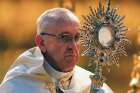 Pope Francis elevates the host as he leads the Corpus Domini procession at the Basilica of Santa Maria Maggiore in Rome on June 18, 2017.