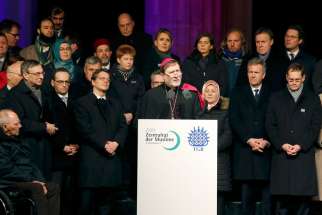 Auxiliary Bishop Matthias Heinrich of Berlin makes remarks during a Jan. 13 vigil in front of the Brandenburg Gate. The vigil was organized by Muslim groups for the victims of the Jan. 7 shootings by gunmen at the Paris offices of the satirical weekly newspaper Charlie Hebdo