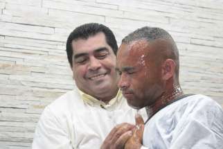 A man getting baptized.