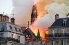 Flames and smoke billow from the Notre Dame Cathedral after a fire broke out in Paris April 15, 2019. Officials said the cause was not clear, but that the fire could be linked to renovation work.