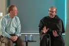 Franciscan Father Paolo Benanti, an adviser to Pope Francis on ethics and technology, talks with Microsoft President Brad Smith about ethics and artificial intelligence during an event on the Microsoft campus in Redmond, Wash., July 23, 2024. Father Benanti is a member of the United Nations’ advisory body on artificial intelligence.