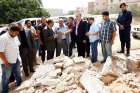 Acting Libyan Prime Minister Abdullah al-Thinni, third from left in front, speaks to the media while visiting the Salah Eddin district after explosions took place at midnight May 21 in Tripoli.  An Islamist group has gained ground in the northeastern Libyan city of Benghazi, declaring it an Islamic territory.