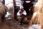 A member of the Ukrainian armed forces is seen at combat positions at the line of separation from Russian-backed rebels near the village of Novomykhalivka in the Donetsk region, Ukraine, Jan. 21.