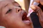 A newly arrived Somali refugee child receives a polio drop at the Ifo extension refugee camp near the Kenya-Somalia border, August 1, 2011.