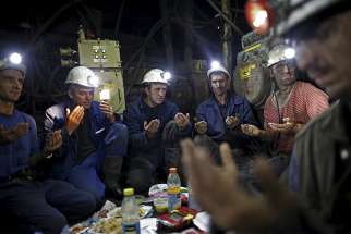  Coal miners pray deep inside the Stara Jama mine in Zenica, Bosnia and Herzegovina, July 15. The entire mining industry must make &quot;radical change&quot; to protect the environment and local communities, Pope Francis says.
