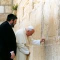 Rabbi Michael Melchior watches as Pope John Paul II prays at Judiasm&#039;s holiest site, the Western Wall, in Jerusalem in March 2000. Pope Francis will visit the Holy Land May 24-26.