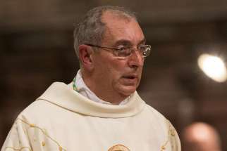 Bishop Angelo De Donatis is seen during his ordination Mass as an auxiliary bishop of Rome in 2015. Pope Francis appointed him his vicar of Rome May 26, which automatically makes him an archbishop. 