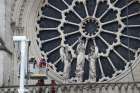 Firefighters inspect one of the rosette windows of Notre Dame Cathedral April 16, 2019, after a fire broke out in the iconic Paris structure. Officials said the cause was not clear, but that the April 15 blaze could be linked to renovation work. 