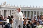 Pope Francis greets the crowd as he arrives to lead his general audience in St. Peter&#039;s Square at the Vatican April 26.