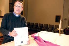 Fr. Michael McGourty, pastor of Toronto’s St. Peter’s parish, shows where the altar stone he found would have been placed to celebrate Mass before the Second Vatican Council changed the rules.