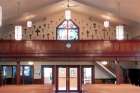 The wall in the loft of Our Lady of Perpetual Help Church in Vancouver is covered with crucifixes from around the world of all different sizes and materials. 