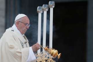 Pope Francis uses incense as he celebrates Mass marking the feast of Corpus Christi outside the Basilica of St. John Lateran in Rome May 26.