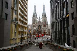 People walk at the site of a Russian missile strike near St. Nicholas Catholic Church in Kyiv, Ukraine, Dec. 20, 2024, amid Russia&#039;s attack on Ukraine. According to the church&#039;s rector, Father Pavlo Vyshkovsky, cited by the Religious Information Service of Ukraine, the windows in the church&#039;s towers were blown out and the stained glass windows were shattered.