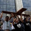 Young people carry the World Youth Day cross to city hall in Rio de Janeiro July 10 as Brazilians make final preparations for World Youth Day and the visit by Pope Francis. Young people from around the globe with join the pontiff for the celebration in R io July 23-28.