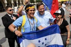 Panamanian President Juan Carlos Varela poses with pilgrims July 31 during World Youth Day at the main square in Krakow, Poland. Pope Francis announced that the next World Youth Day will take place in Panama in 2019.