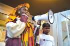 Una Momolu and her son Emmell appeared at a rally demanding an apology from school officials after her child was told to remove his durag.