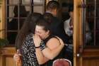 Friends of elementary school teacher Elsa Mendoza, who was killed during the Aug. 3, 2019, shooting at a Walmart store in El Paso, Texas, mourn during her wake Aug. 8 in Ciudad Juarez, Mexico.