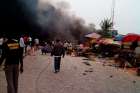 Smoke rises after a bomb blast in Nigeria, May 20.  Nearly 200 churches have been destroyed or razed by Boko Haram insurgents since August, a Maiduguri Diocese official said.