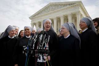 Sister Loraine Marie Maguire, mother provincial of the Denver-based Little Sisters of the Poor, speaks to the media outside the U.S. Supreme Court in Washington March 23 after attending oral arguments in the Zubik v. Burwell contraceptive mandate case.